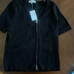 Black zip short sleeve sweater.
